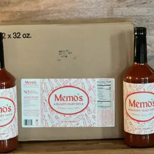 A box of memos hot sauce with two bottles.